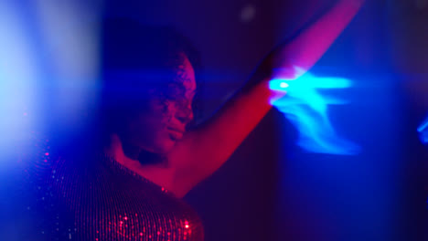 Close-Up-Of-Young-Woman-In-Nightclub-Bar-Or-Disco-Dancing-With-Sparkling-Lights-5